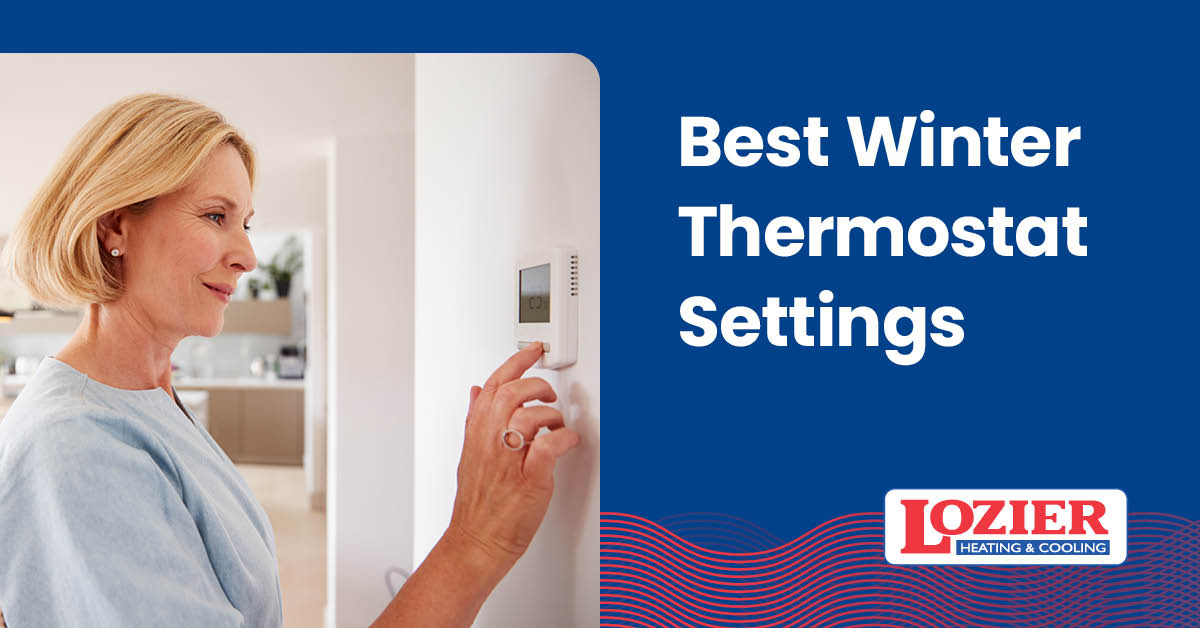 Woman using thermostat.